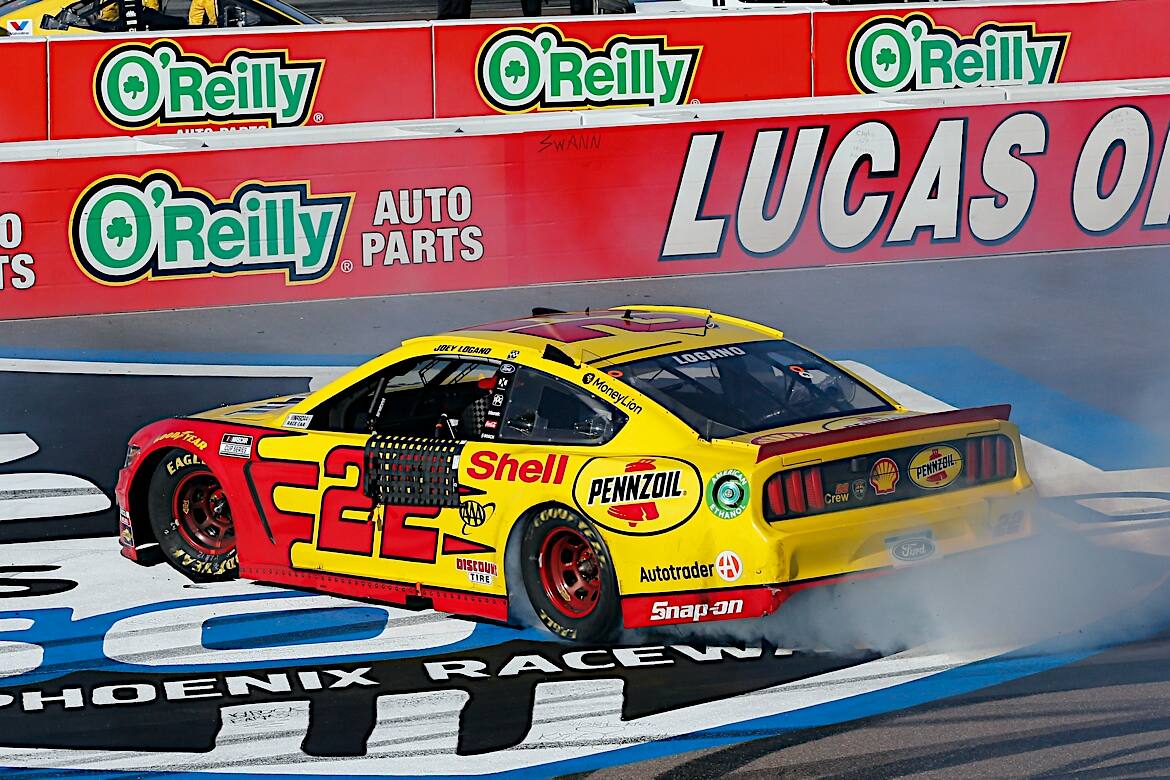 Logano held off Stewart-Haas Racing's Kevin Harvick in OT. Logano held off Stewart-Haas Racing's Kevin Harvick in OT.